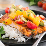 baked salmon with mango avocado salsa served over rice