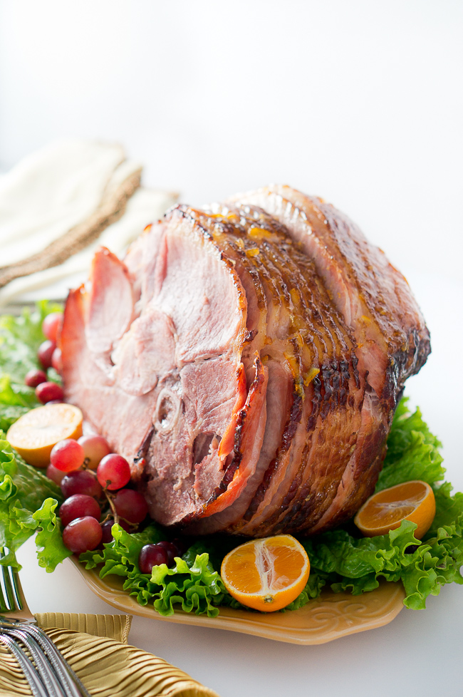 Orange Dijon Glazed Ham - Succulent spiral ham is brushed with a sweet and tangy orange dijon glaze, then roasted until perfection, creating a delicious caramelized outer layer.