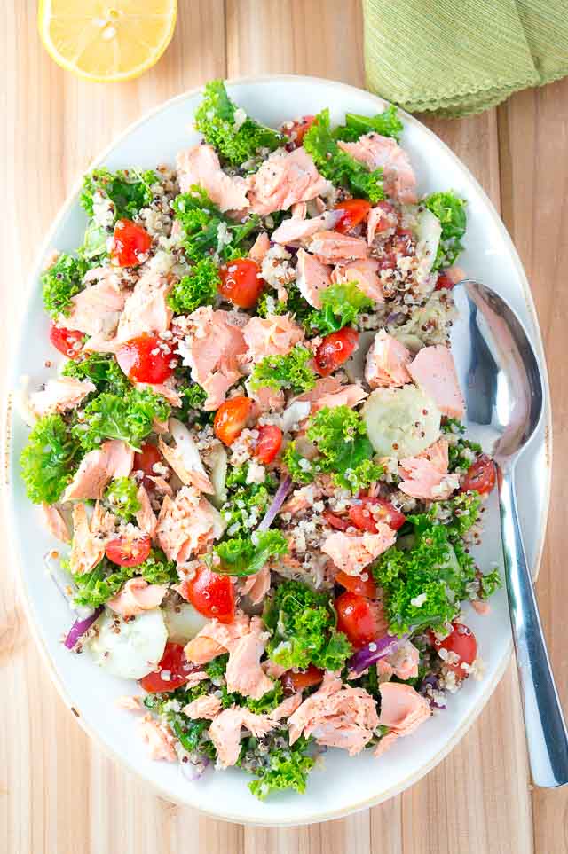Delicious Salmon Quinoa and Kale Salad that is bursting with flavor and healthy ingredients. Perfect weeknight dinner - 15 min. to cook and easy prep work.