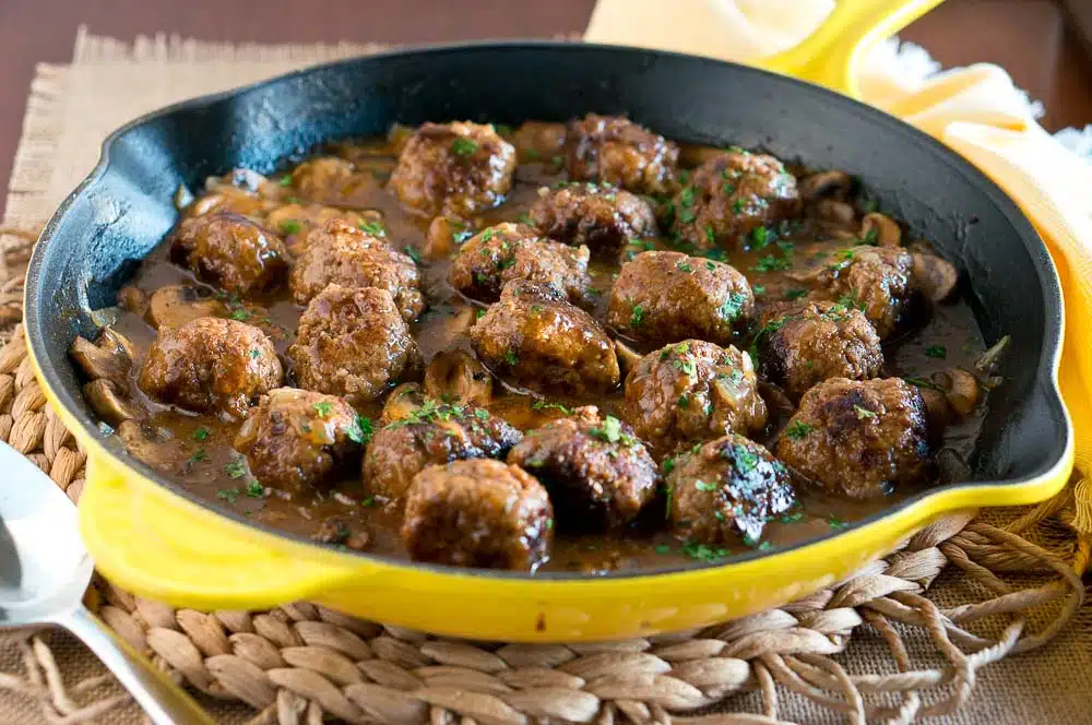 Salisbury Steak Meatballs w/ Mushroom Gravy is a great dinner idea for busy weeknights. It comes together in 30 minutes - so delicious & comforting!