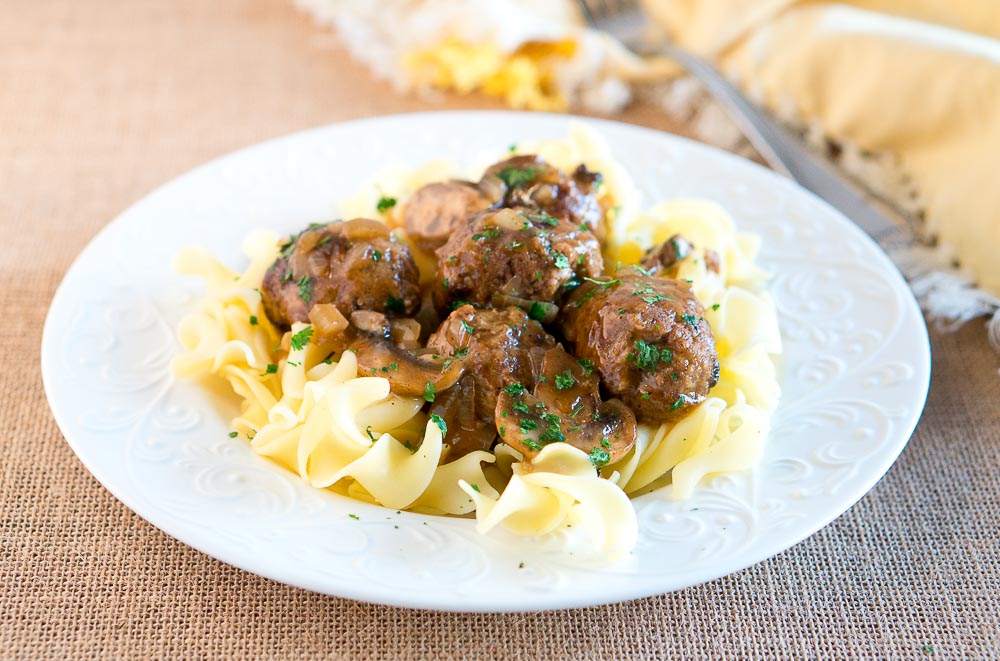 Salisbury Steak Meatballs w/ Mushroom Gravy is a great dinner idea for busy weeknights. It comes together in 30 minutes - so delicious & comforting!