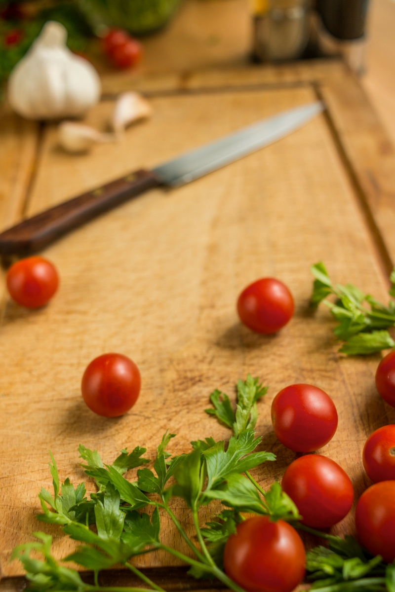 cherry tomatoes on a cutting board