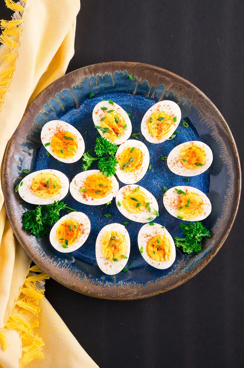 hard boiled eggs with bright yellow yolks on a plate