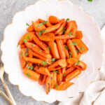 honey glazed carrots served in a white bowl