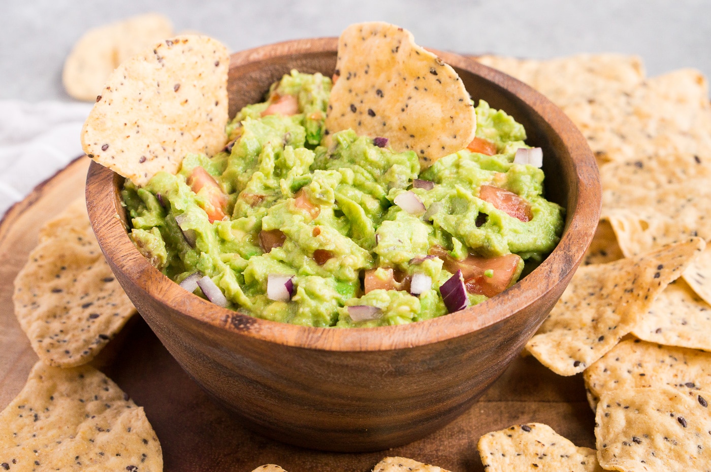 classic guacamole in a wooden bowl