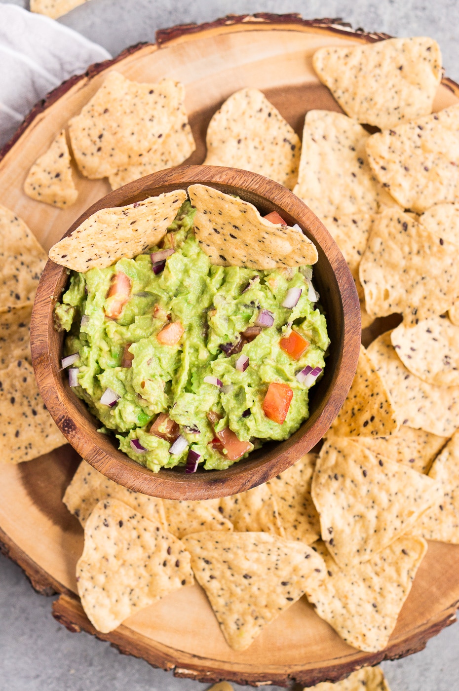 avocado dip with chips in a bowl