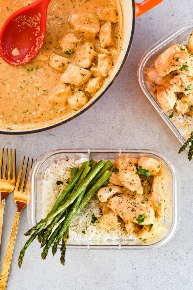 Dijon Thyme Chicken Tenders with rice and asparagus in a meal prep container