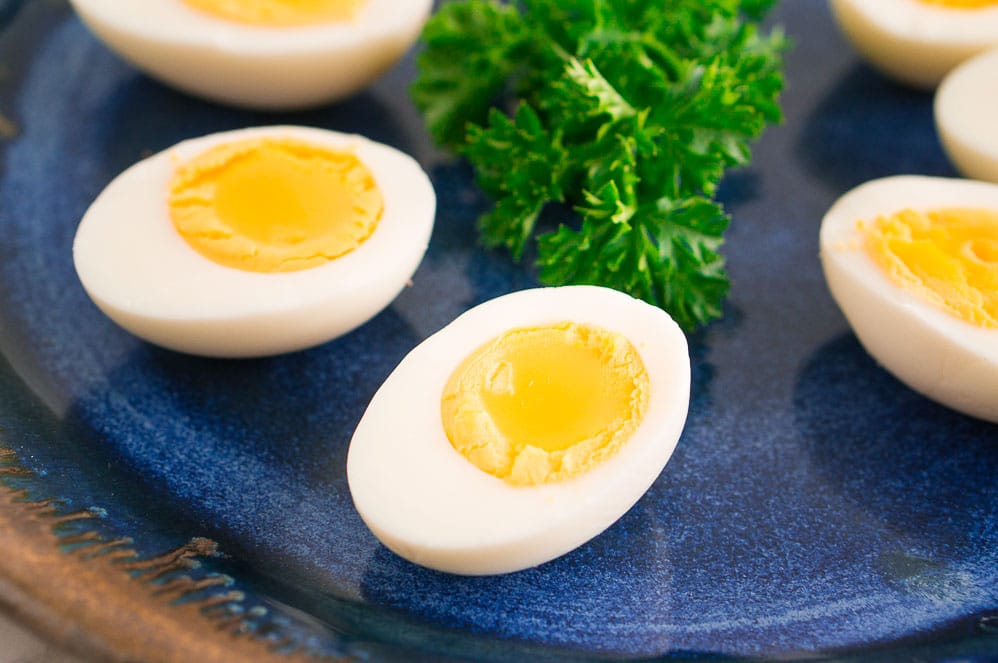 hard boiled eggs on a blue plate 