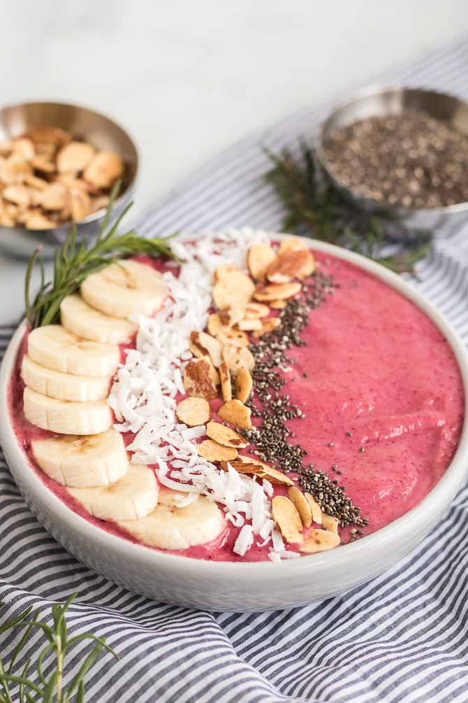 cranberry banana smoothie bowl with toppings