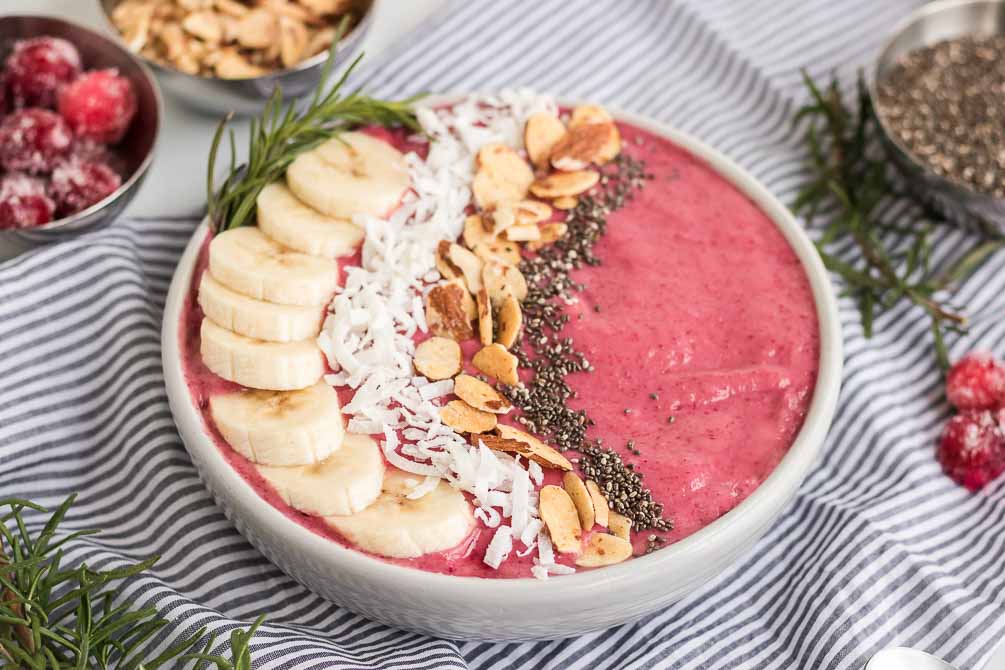 cranberry smoothie bowl with toppings