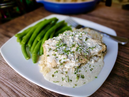 creamy ranch pork chops on plate with green beans