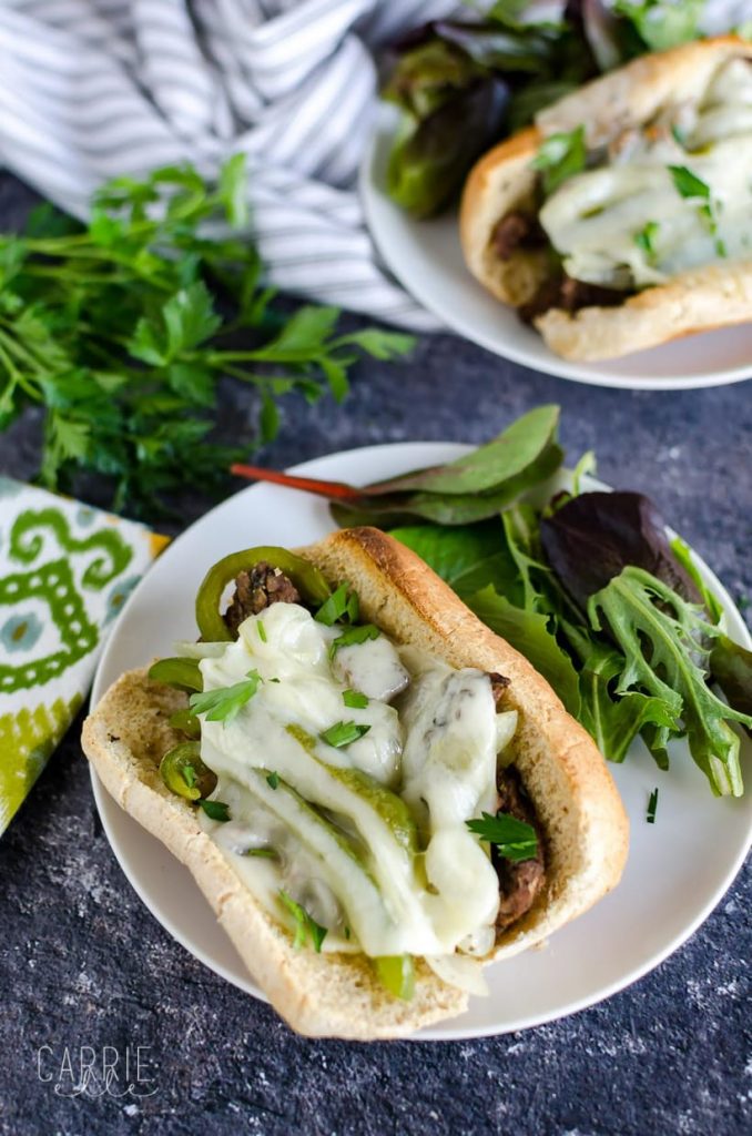 Instant Pot Philly Cheesesteak on a plate with greens