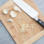 minced garlic on a cutting board