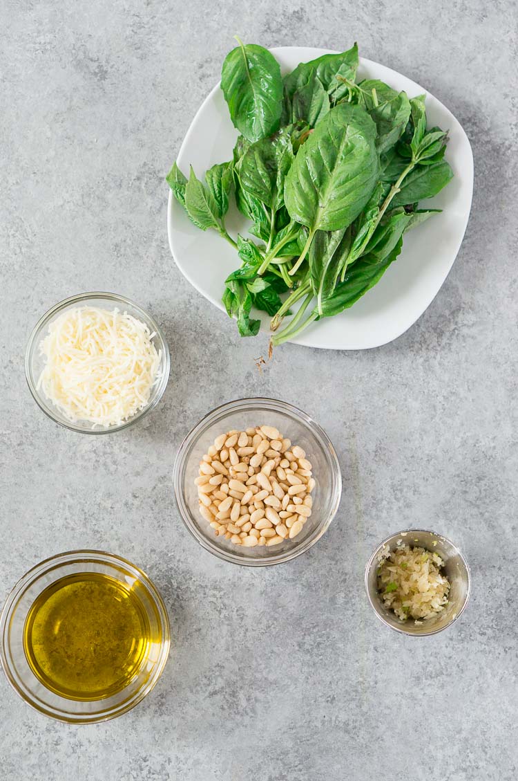 pesto ingredients on a gray board