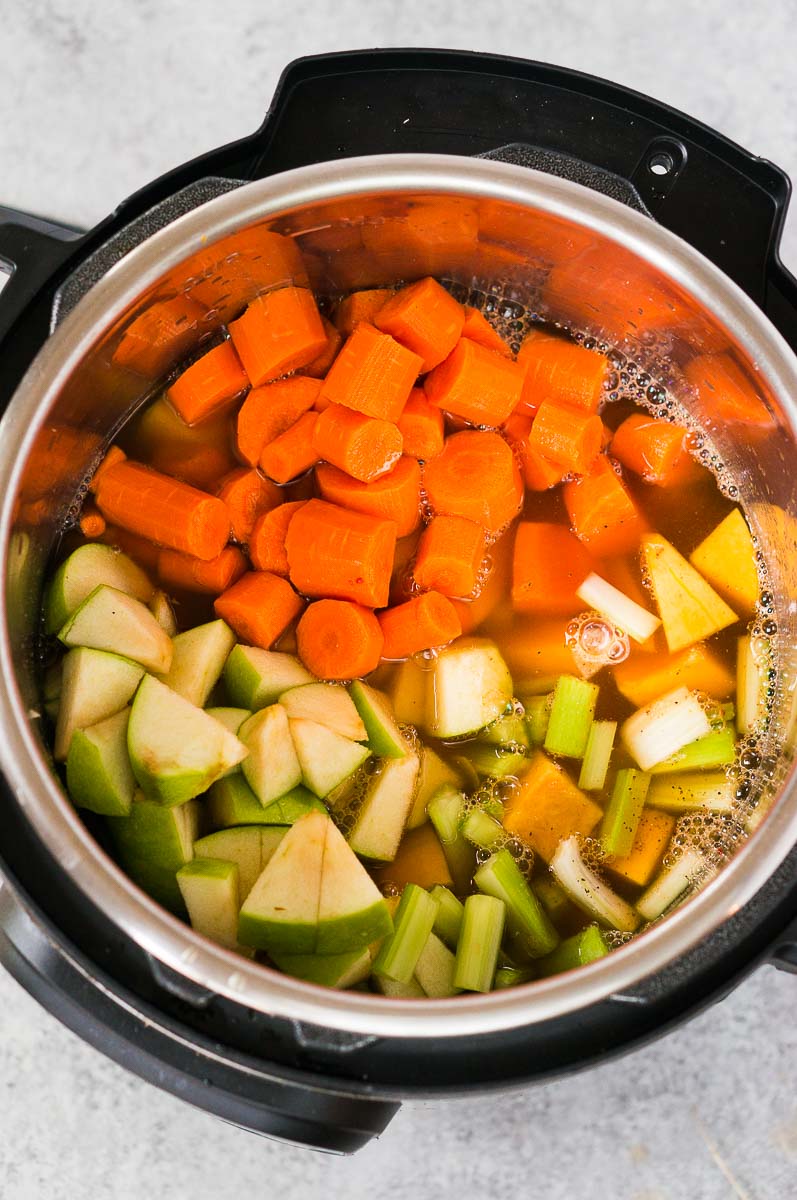 vegetables and stock in instant pot for butternut squash soup