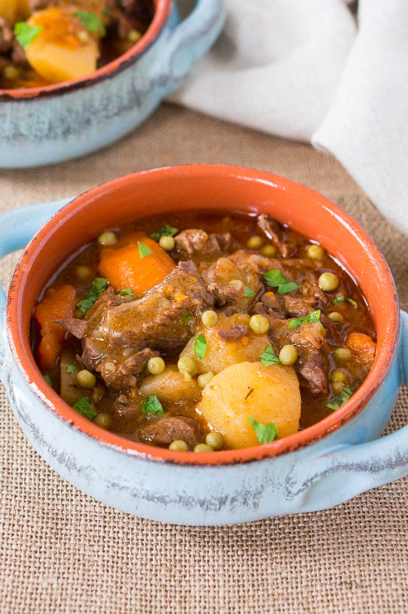instant pot beef stew in a clay bowl