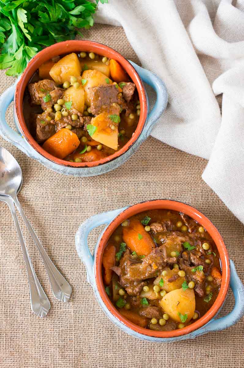 pressure cooker beef stew in two clay bowls