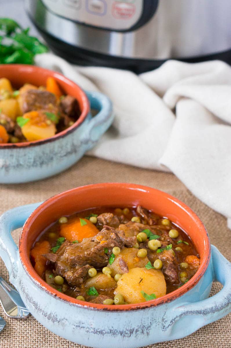 beef stew made in pressure cooker served in bowls