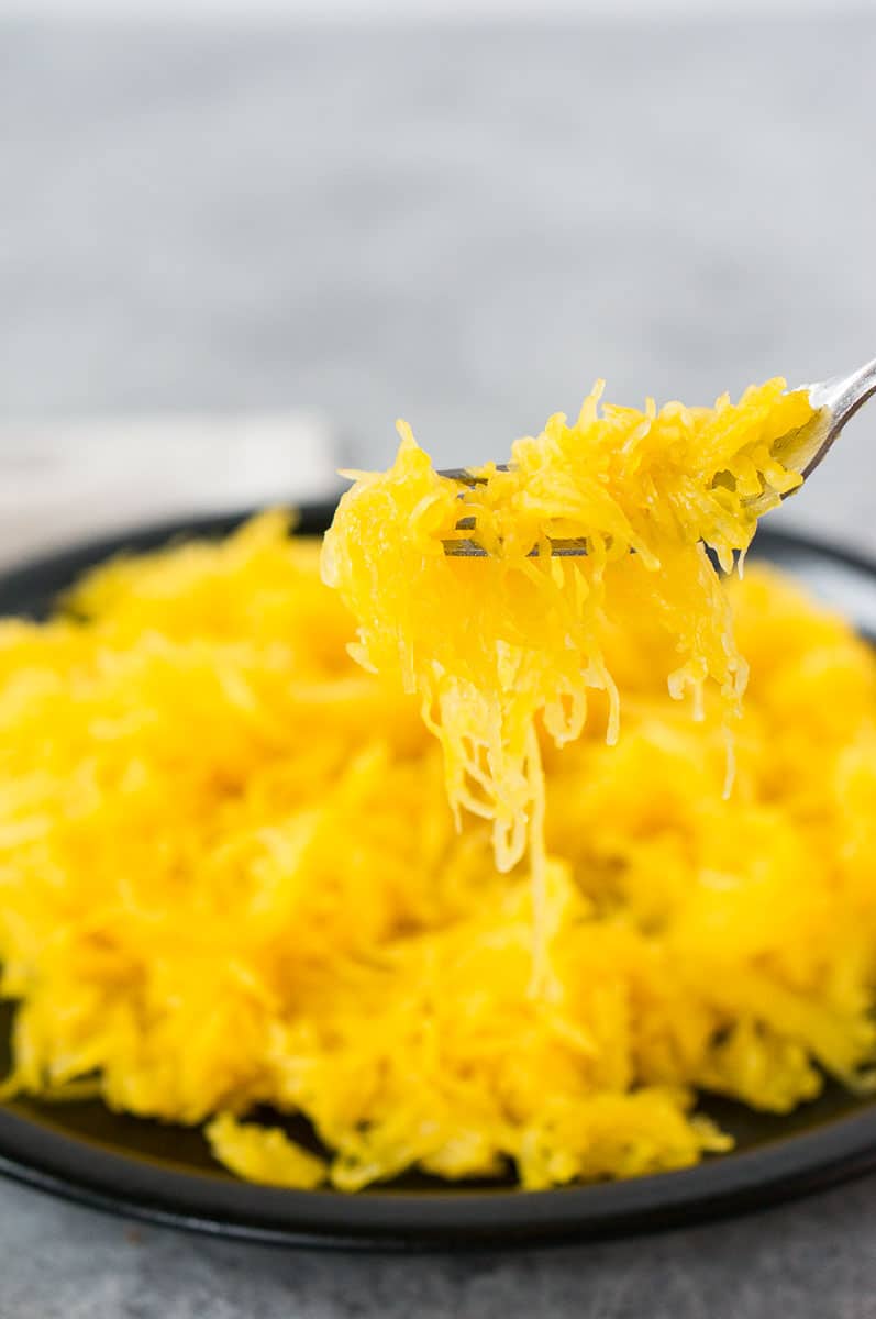close up of scooping cooked spaghetti squash