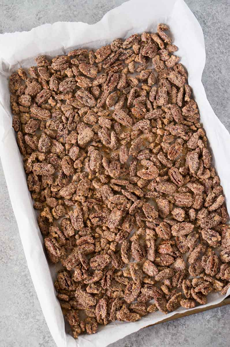 oven baked candied pecans on a baking sheet