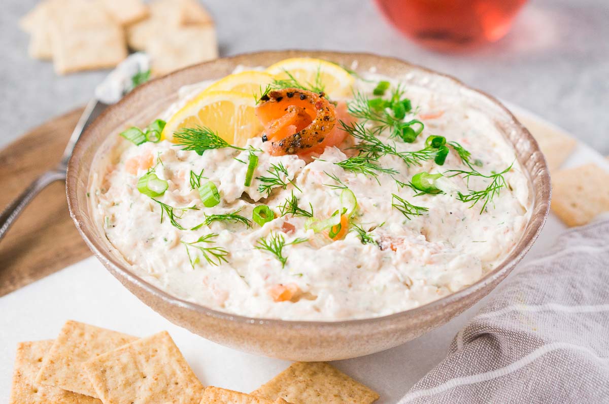 smoked salmon dip with crackers in a bowl
