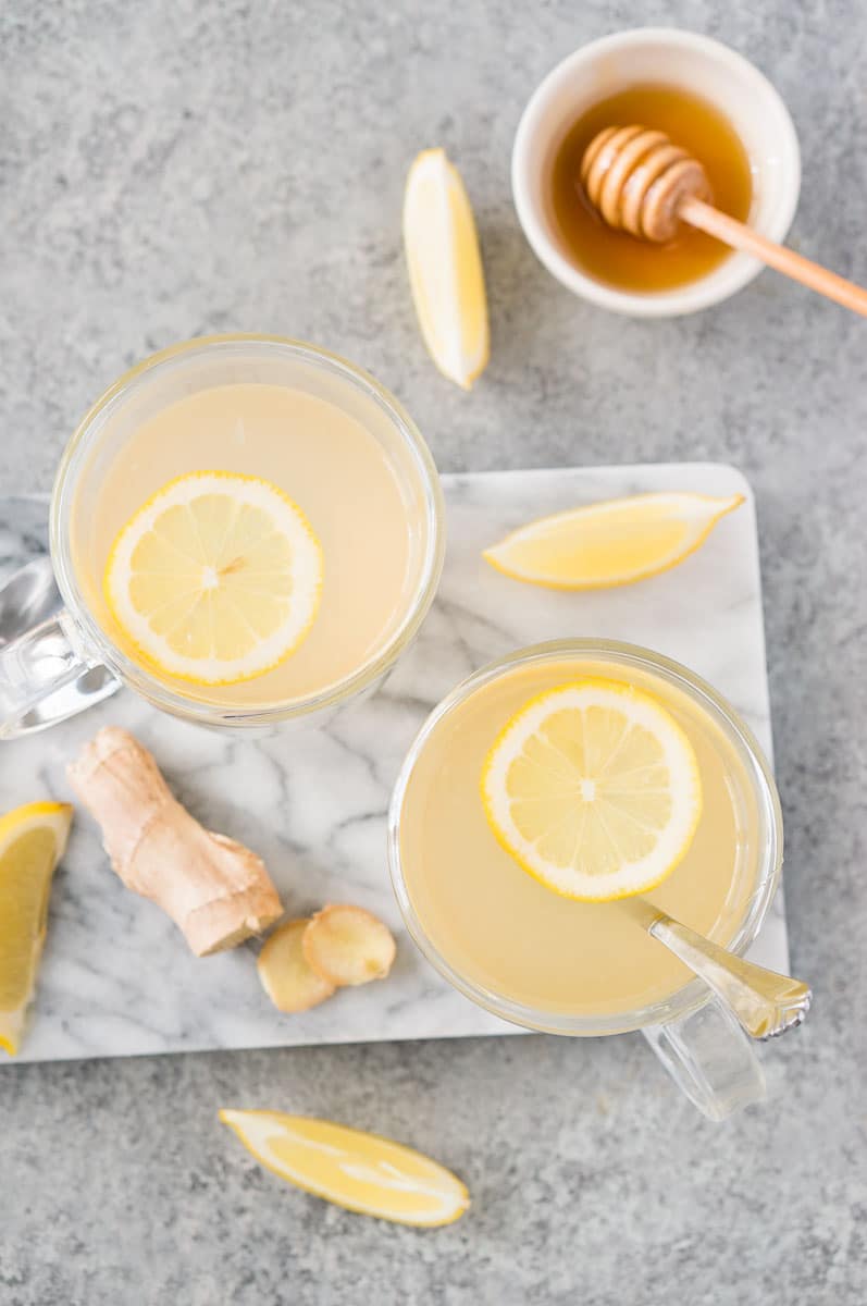 honey ginger tea in glass cups with lemon slices