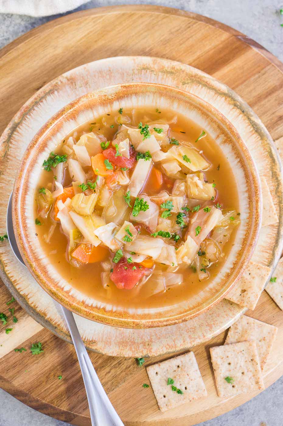 old fashioned cabbage soup served in a bowl with crackers