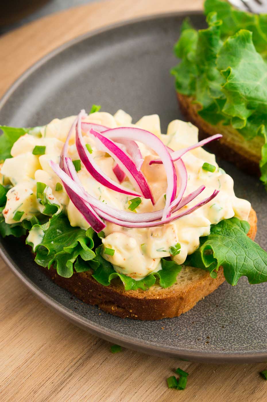 egg salad on a slice of bread with lettuce