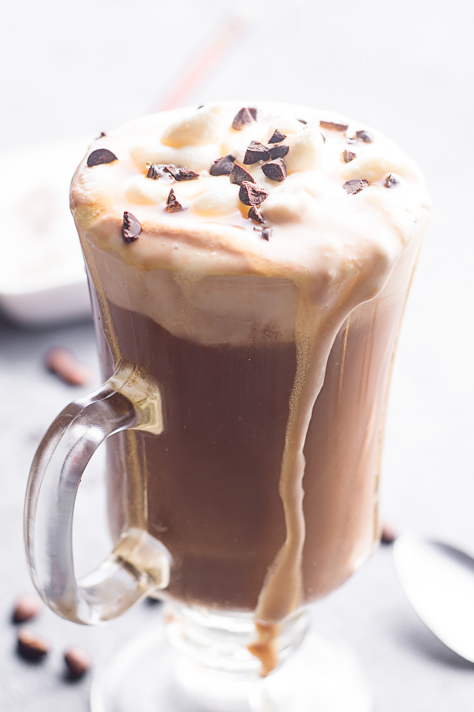 coffee with milk and cocoa served in a tall glass 