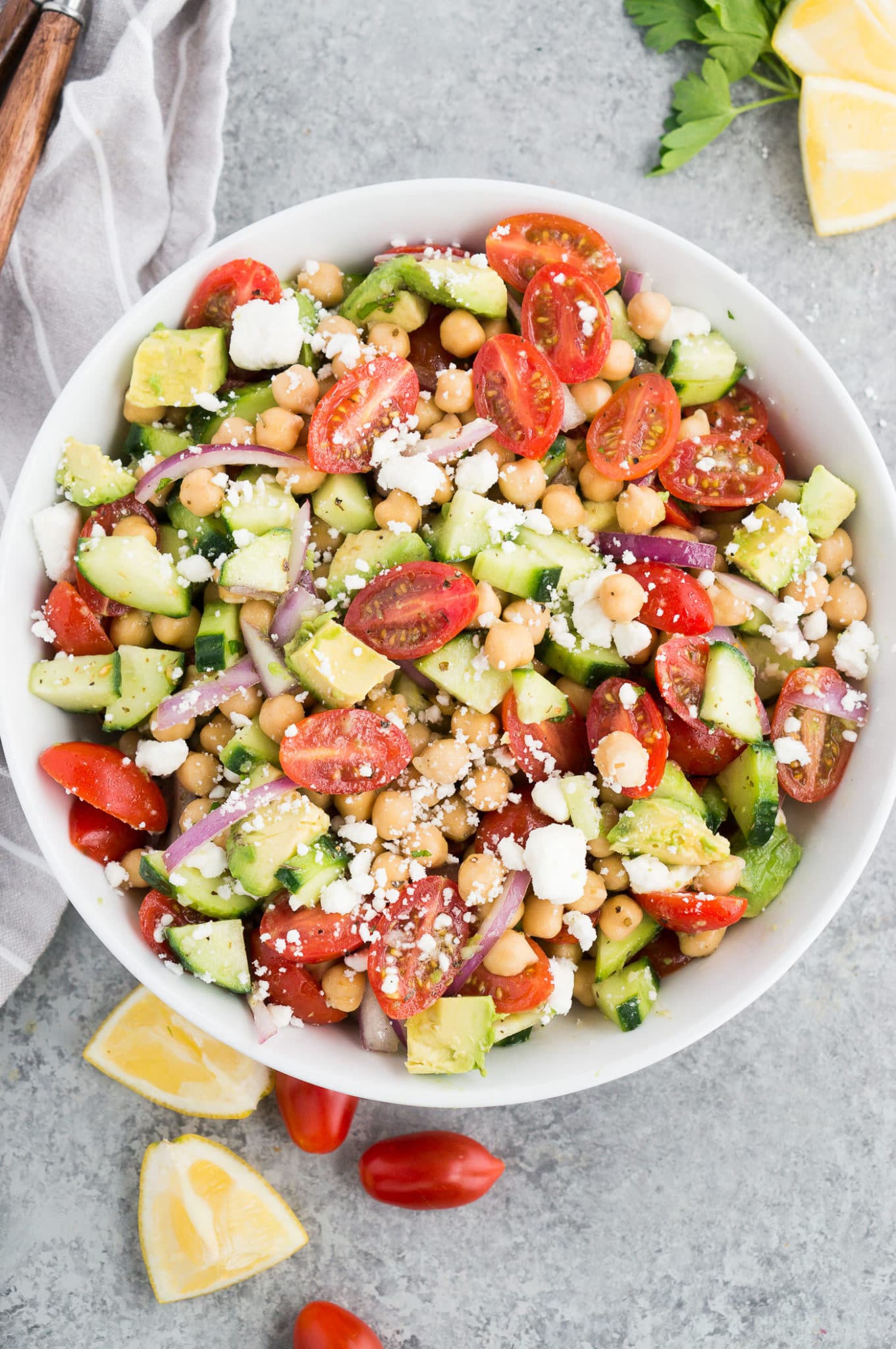 garbanzo bean salad recipe with tomatoes and cucumbers in a bowl
