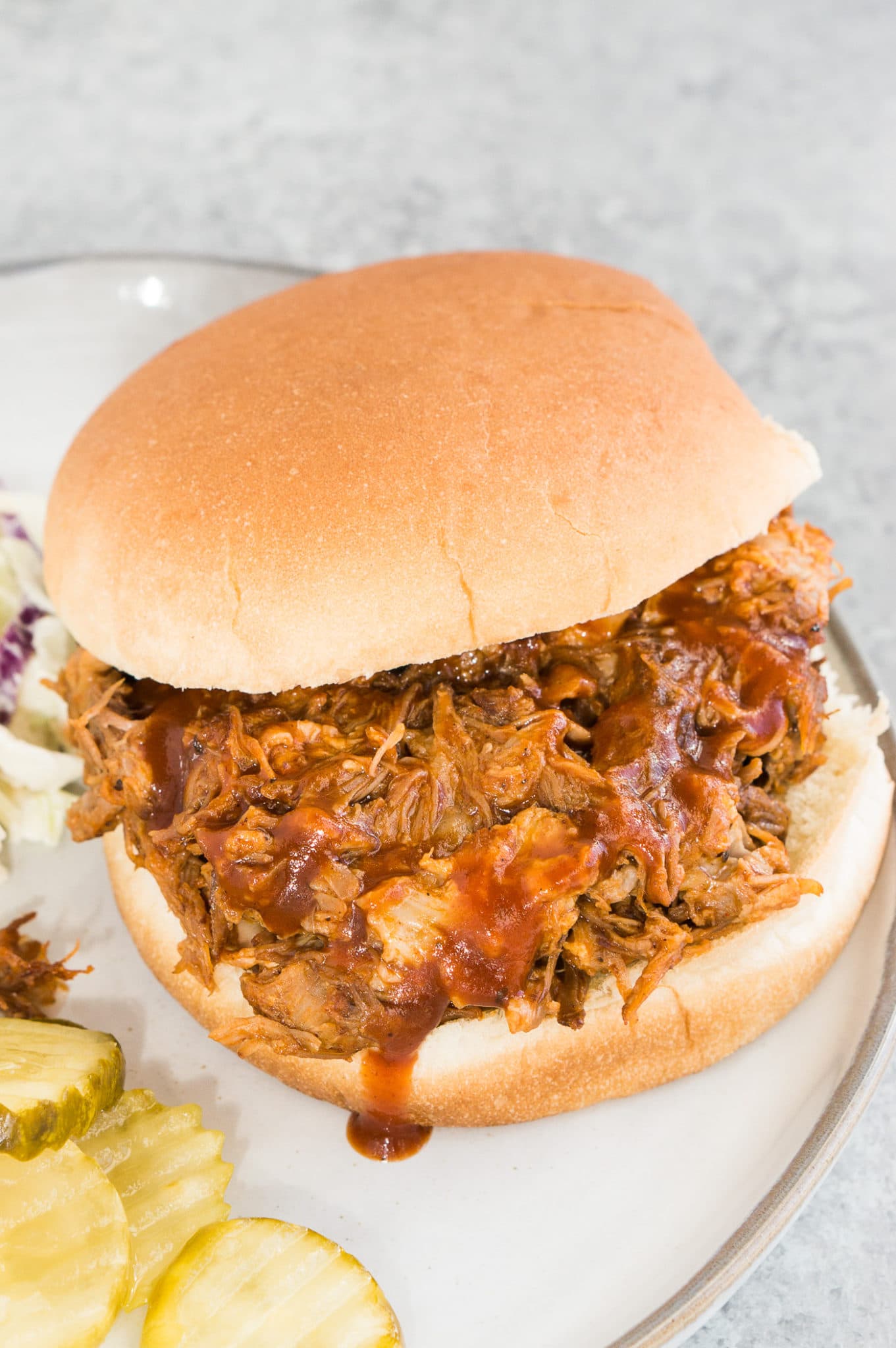 homemade pulled pork made in the instant pot and served on a bun