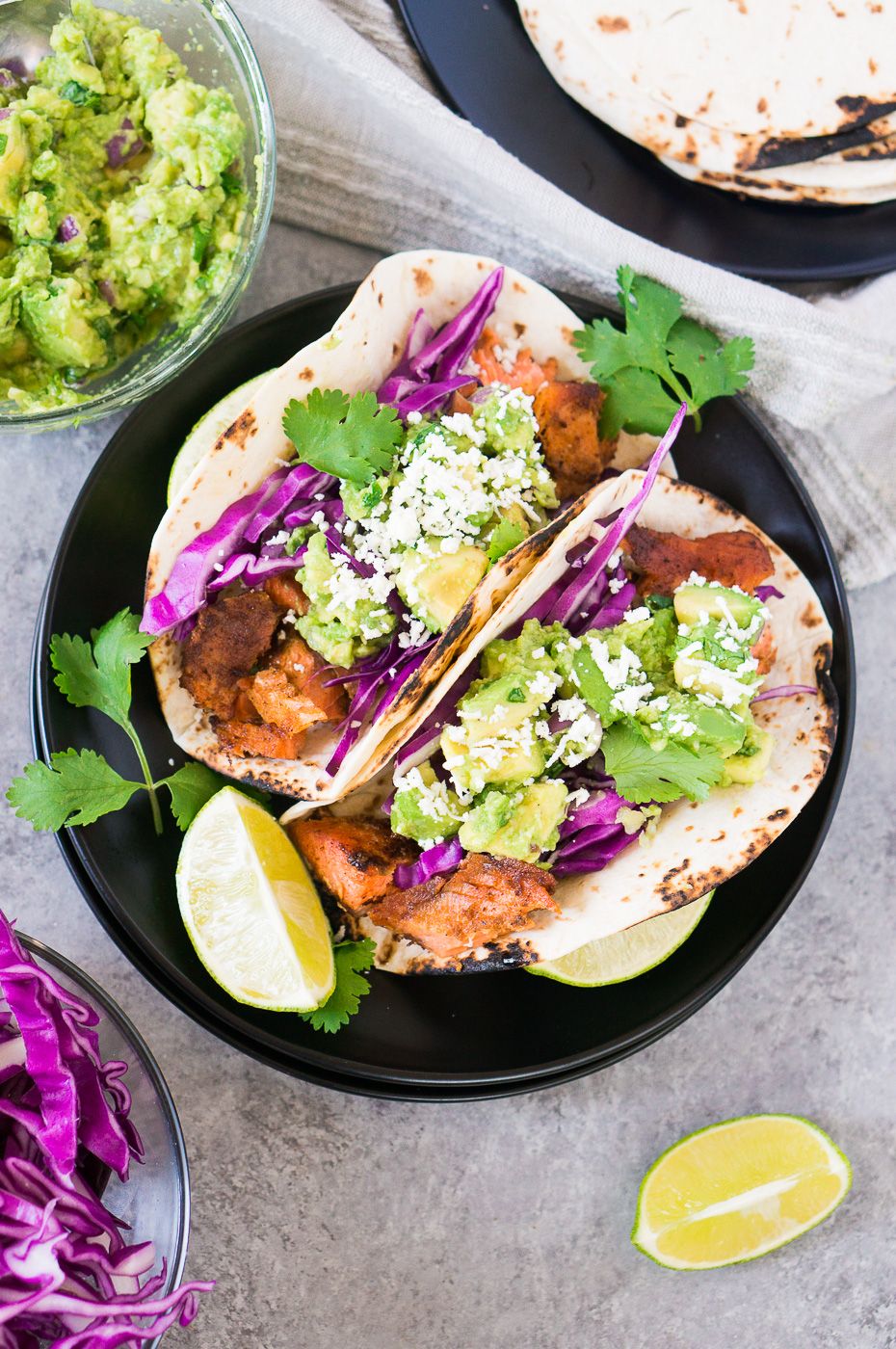 salmon tacos recipe with avocado salsa and cabbage