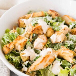 Chicken Caesar salad with homemade Caesar dressing in a bowl