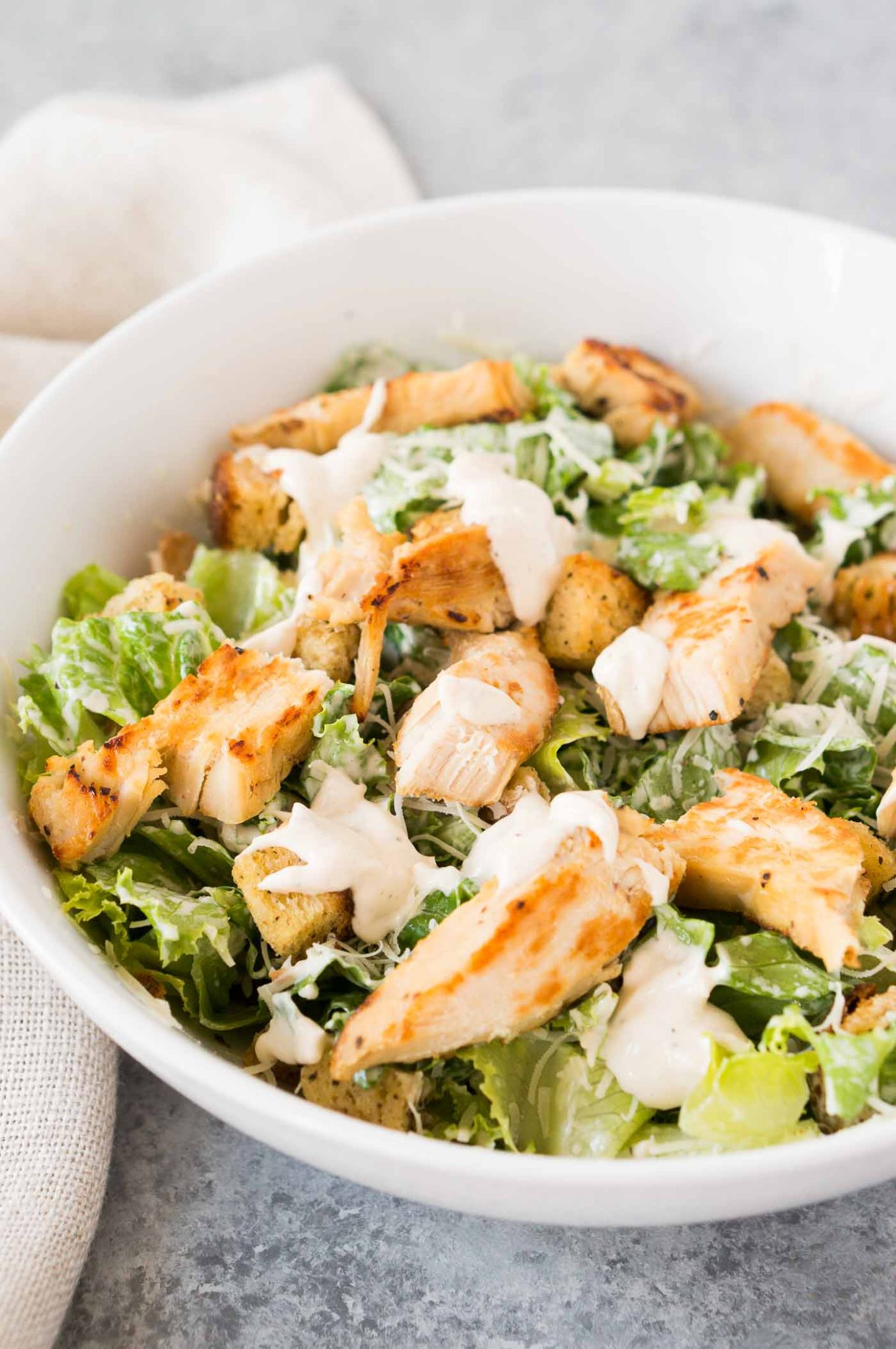 Chicken Caesar salad with homemade Caesar dressing in a bowl