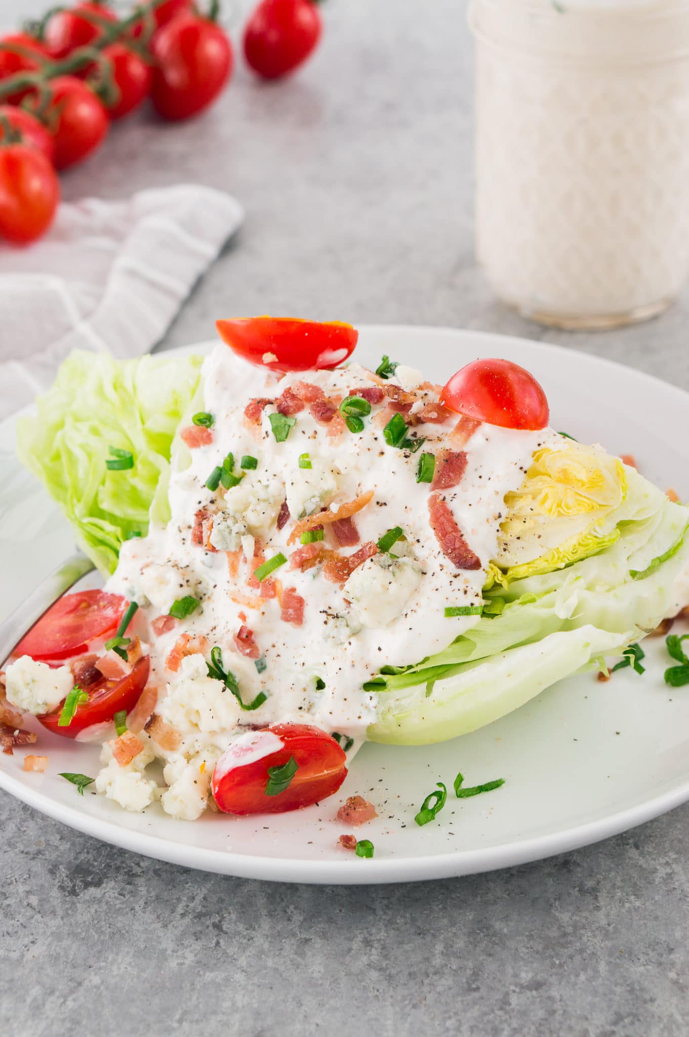 blue cheese dressing drizzled on a wedge salad