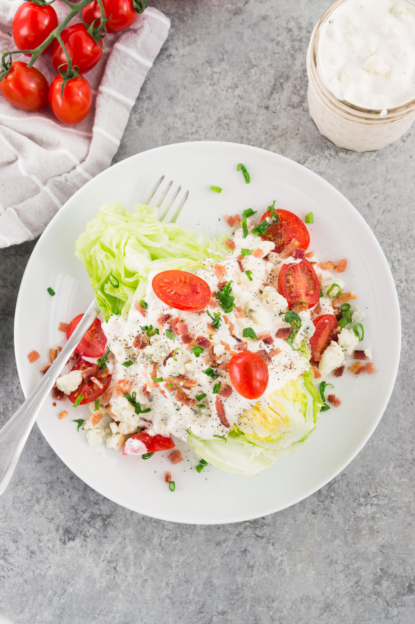 blue cheese wedge salad recipe on a white plate