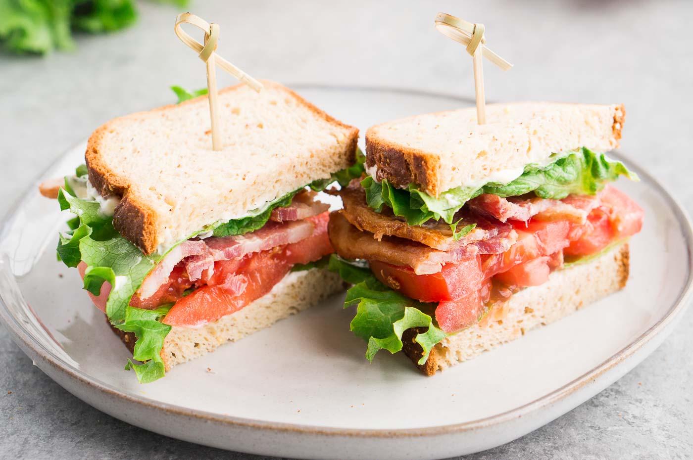 bacon lettuce tomato sandwich cut in half