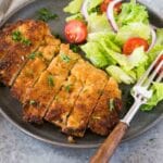 chicken milanese and a salad on a plate