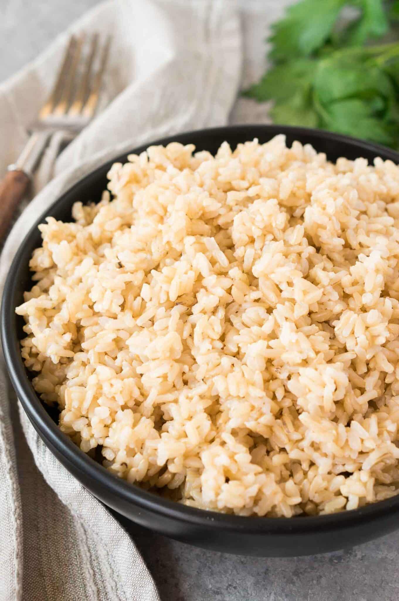 close up image of cooked brown rice in a bowl
