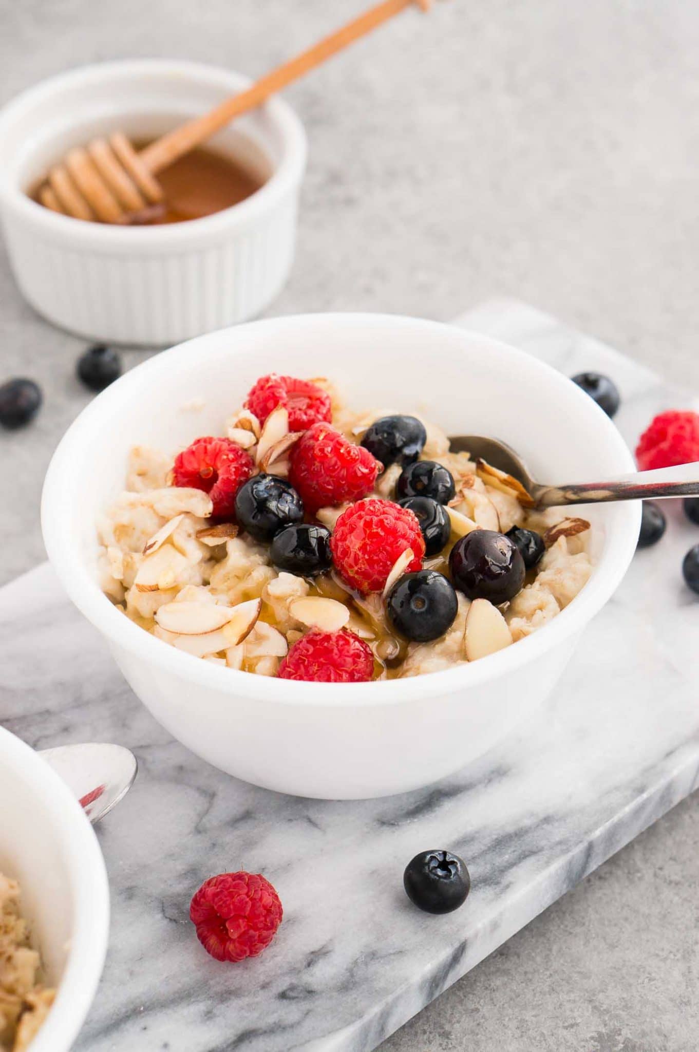 instant pot rolled oats with berries in a bowl