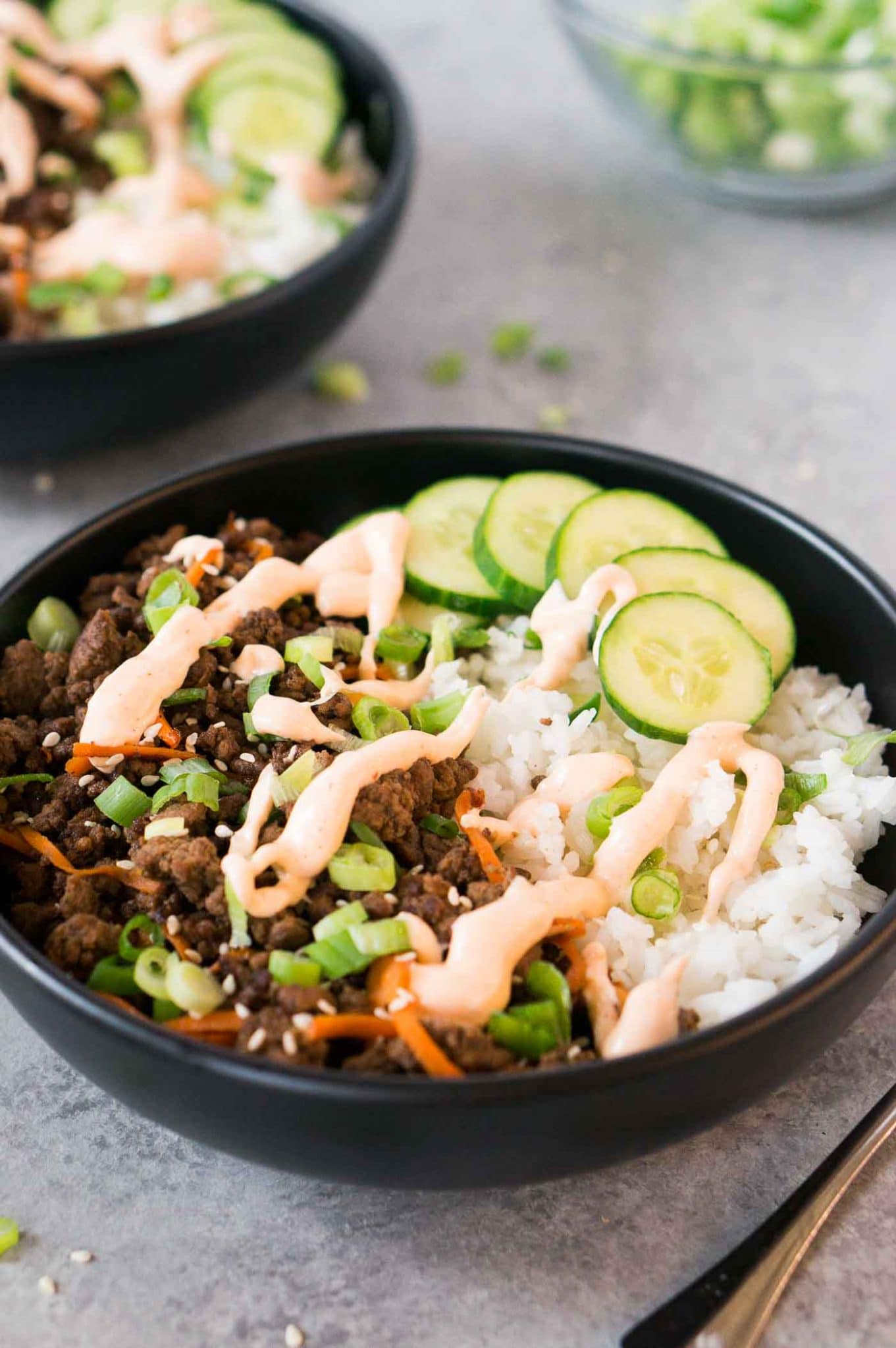 Korean beef bowl with sriracha mayo and rice in a bowl