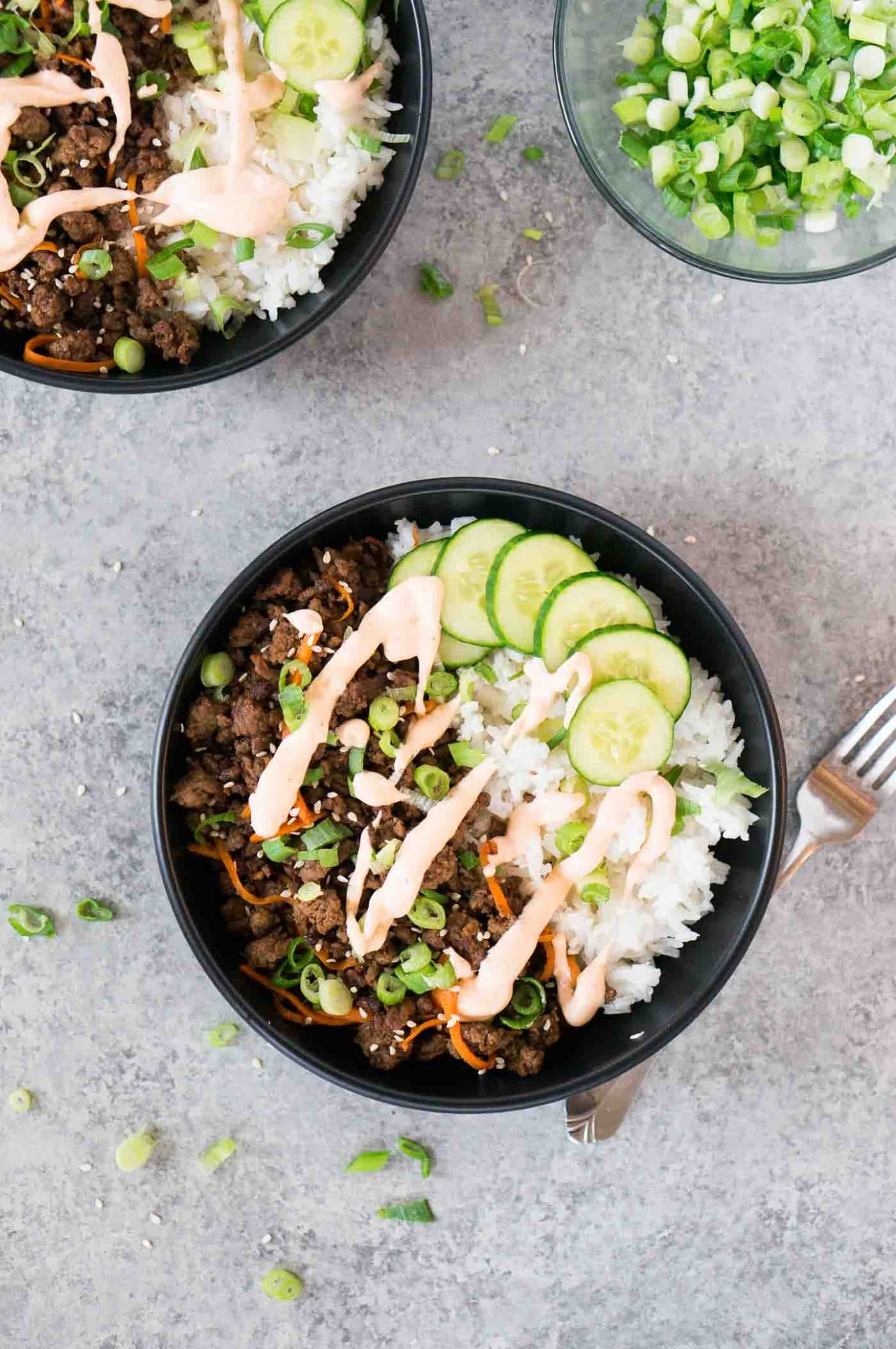 Korean beef recipe with sriracha mayo with rice in bowls 