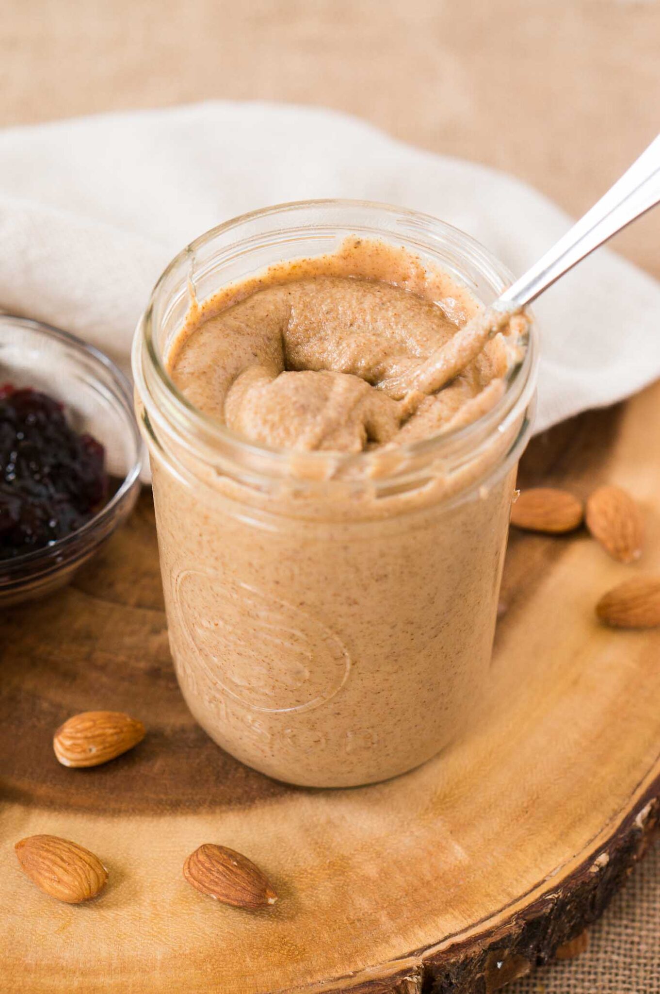 easy homemade almond butter in a jar with a spoon