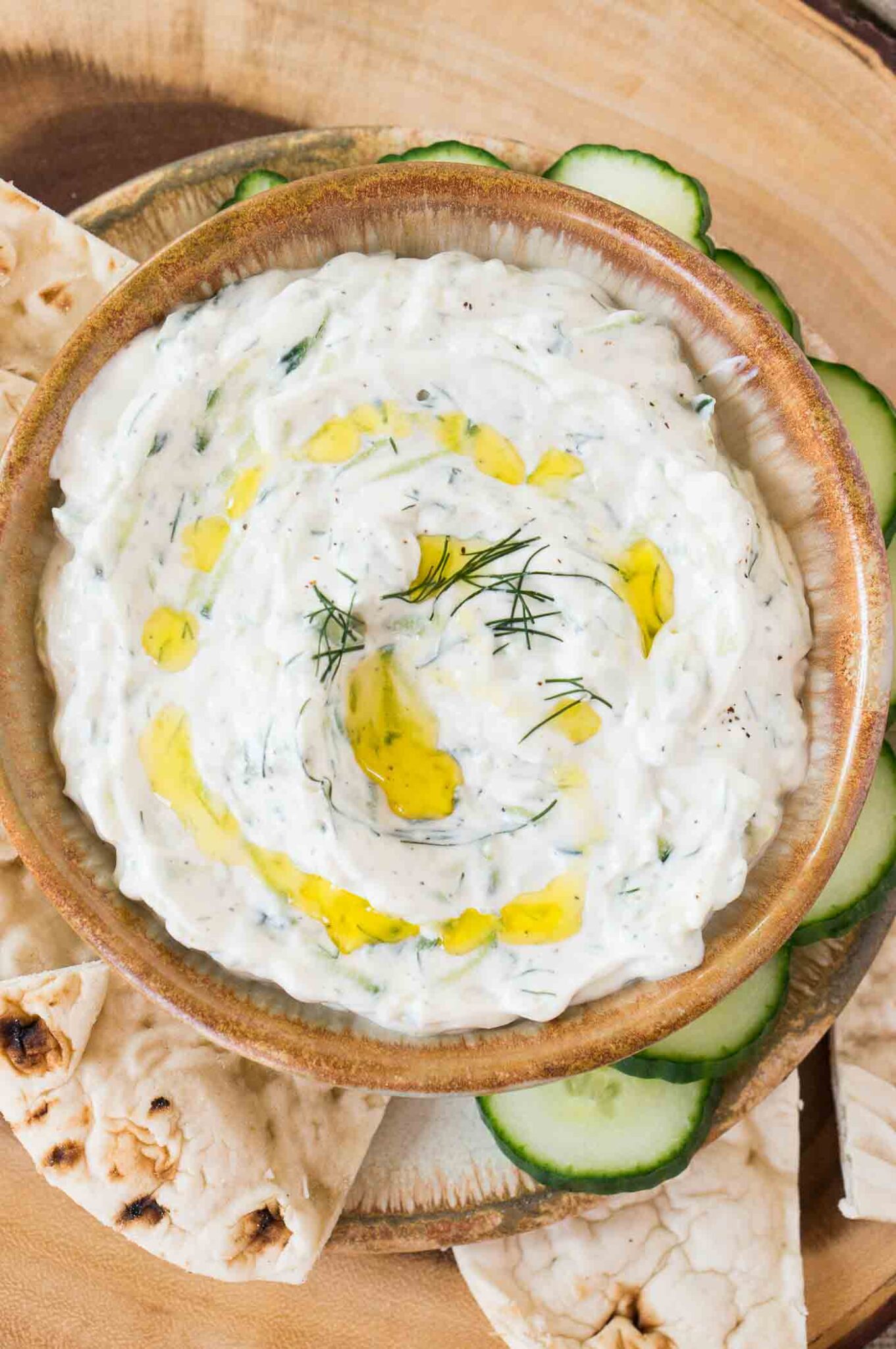 tzatziki sauce in a bowl served with pita bread