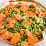 quick and east peas and carrots recipe served in a bowl
