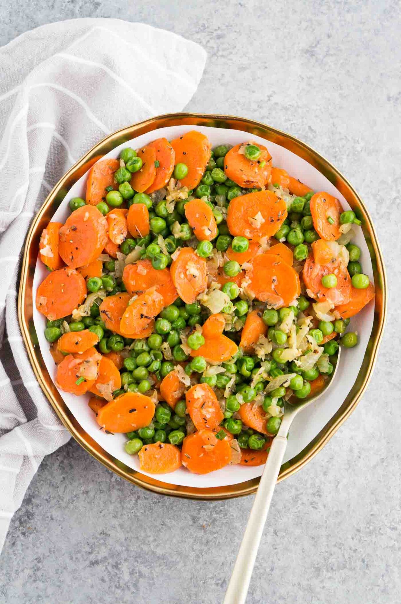 carrots and peas serving on a plate