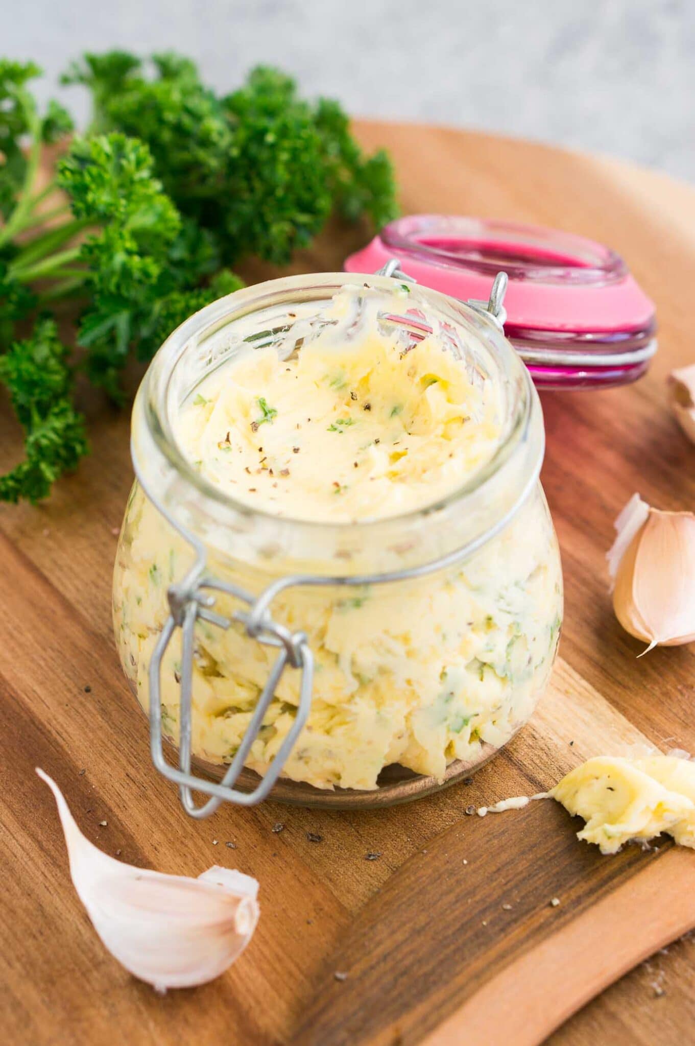 butter with garlic and herbs in a jar
