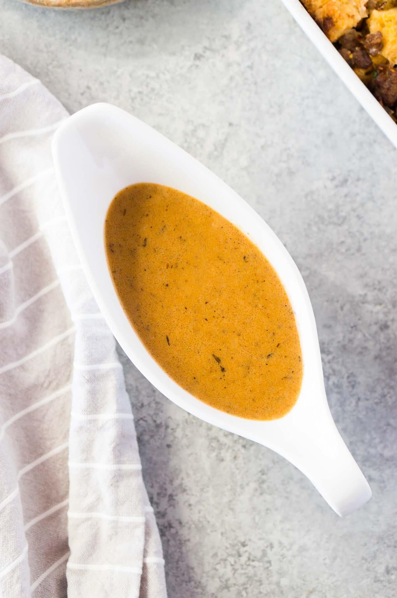 close up image of homemade gravy in a gravy boat