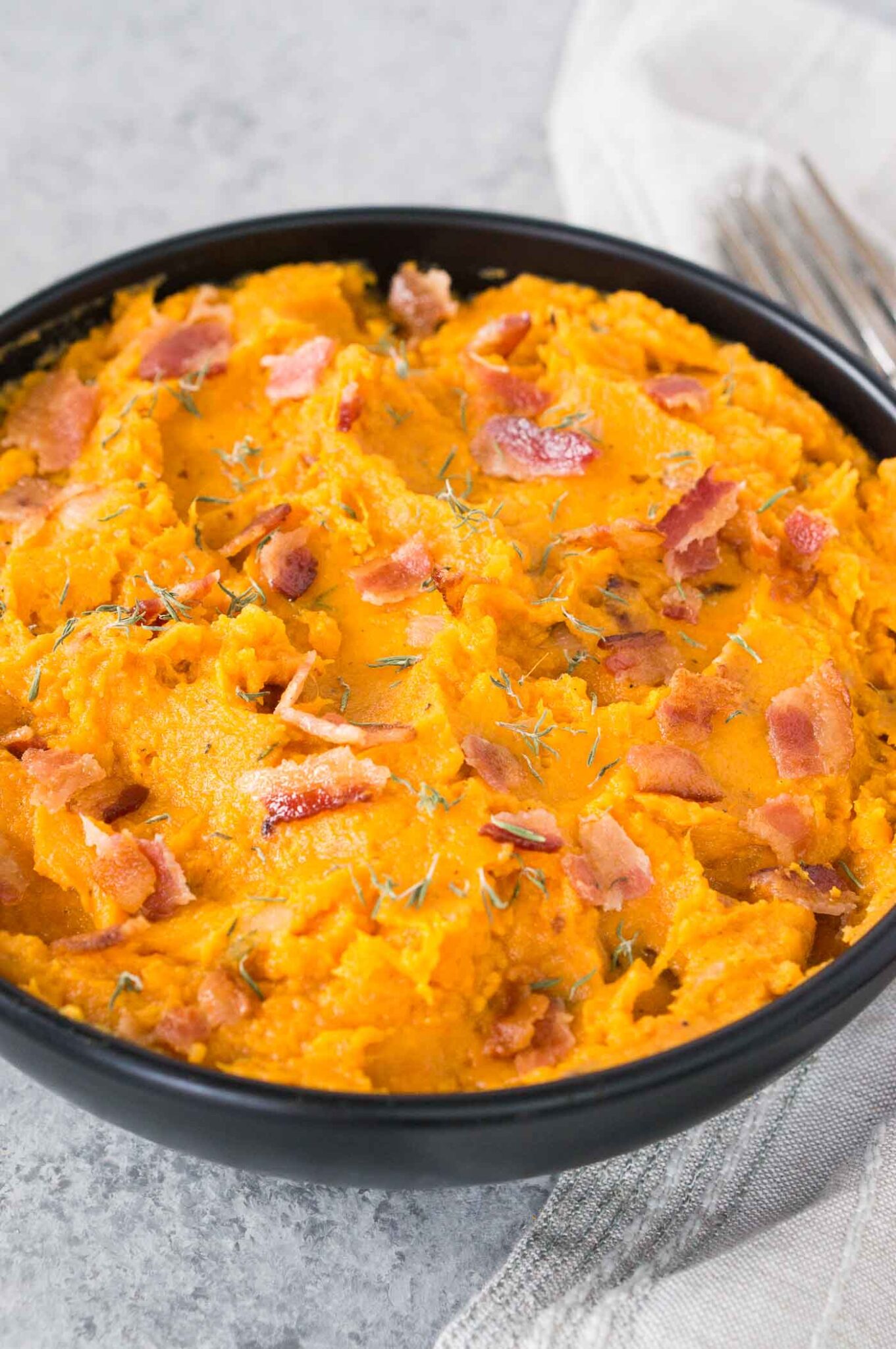 bacon with mashed and roasted sweet potatoes in a bowl