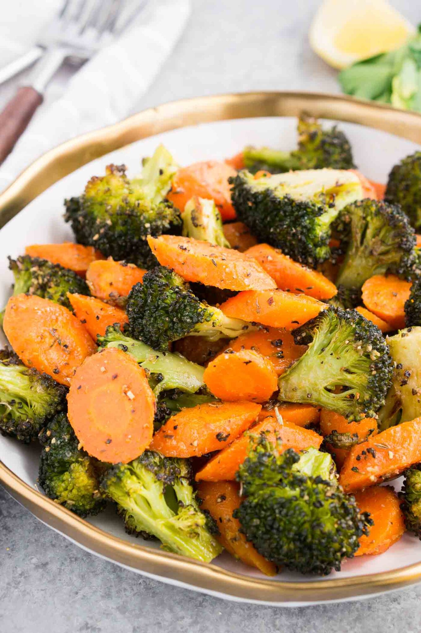 easy and quick roasted carrots and broccoli in a white bowl